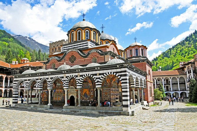 The striped arcades of Rila Monastery under the Rila mountains